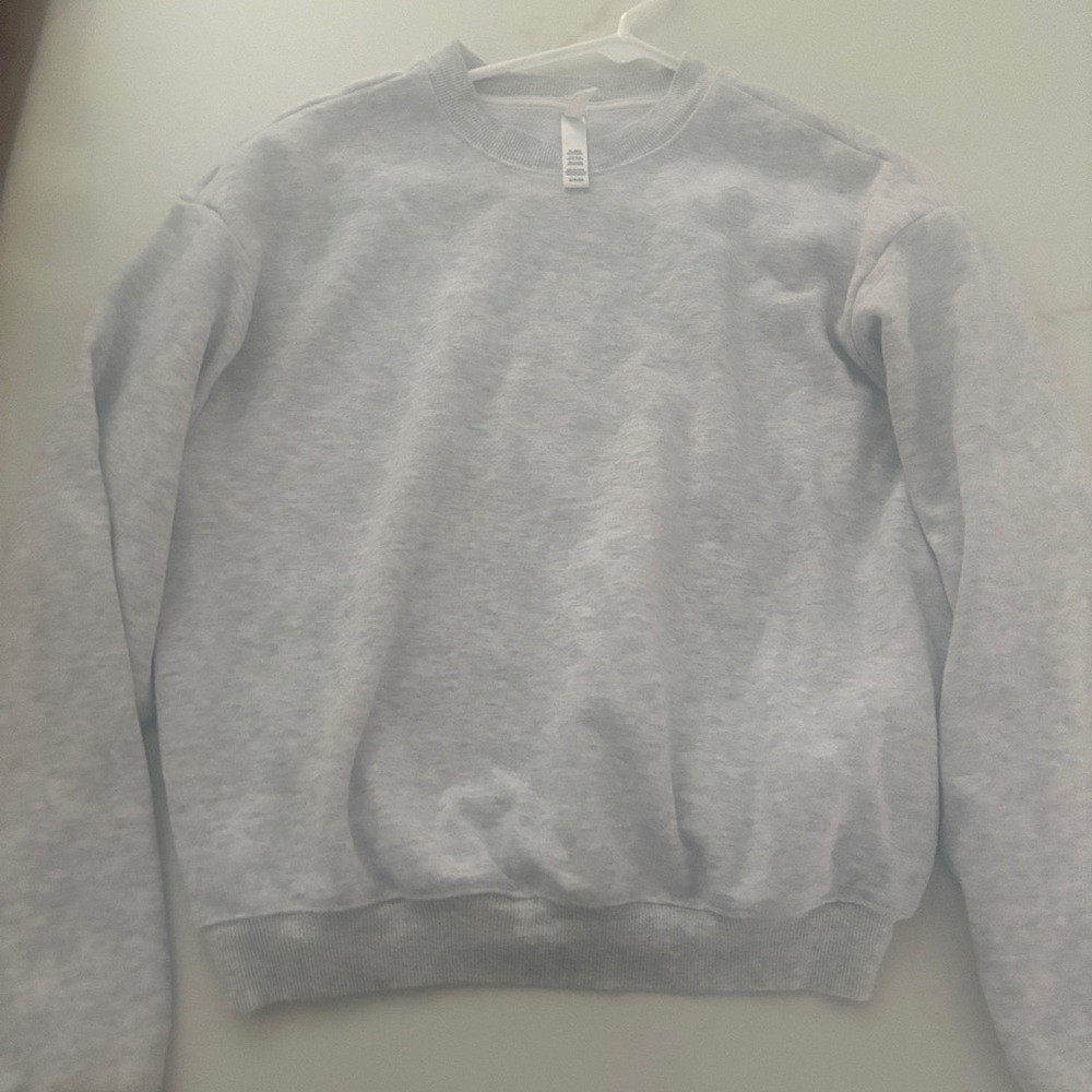 Skims cotton fleece classic crewneck in light heather grey.